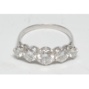 A five stone diamond line ring, linear set with five graduated round brilliant cut diamonds from approx 0.75ct to 0.25ct, total estimated diamond weight approx 2.25ct, platinum shank, size R, 3.3g gross