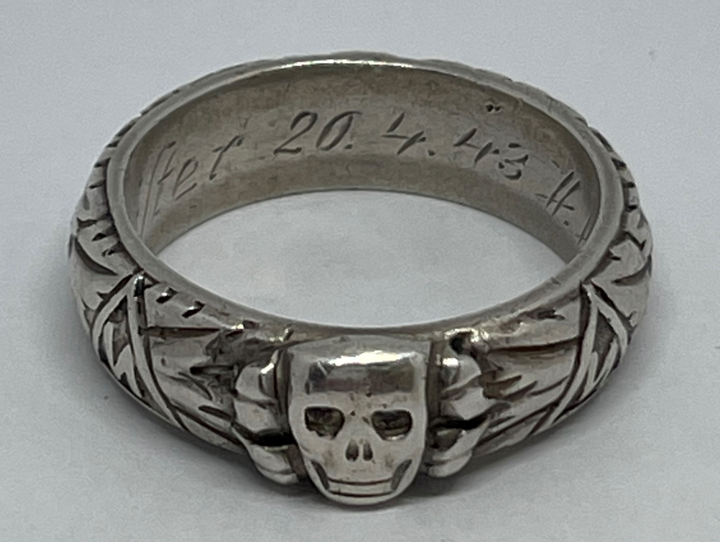 WW2 Third Reich SS Ehrenring Totenkopf Honour Ring. Inscription engraved to the band "Slb Beister 20.4.43 H. Himmler". Along with a 2nd edition of "SS Totenkopf H Himmler Honor Ring 1933-1945" soft bound book by Don Boyle.