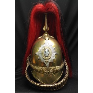 British Victorian 1871 Pattern Cavalry  Helmet. Brass skull with 4th Dragoon Guards regimental helmet plate to front. Helmet has brass cross base and fluted plume holder which houses a falling red/black horse hair plume. Rosette to top of holder. Copper rosettes which hold the chin chain backed with black leather. Dark brown leather liner. Underside of peak has a thin leather covering.