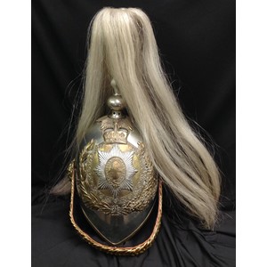 British Victorian 1871 Pattern Life Guards  Helmet. Silvered skull. To the top of the helmet is a gilt acanthus leaf holder which supports the falling white horse hair plume. Gilt rose pattern ear bosses, support a modern replacement gilt brass leather backed chin chain. To the front is the helmet plate of a half laurel and half oak leaf wreath surrounding the collar of the Order of the Garter and surmounted by a Queens Crown. The liner is a modern 20th Century replacement in tan coloured leather.