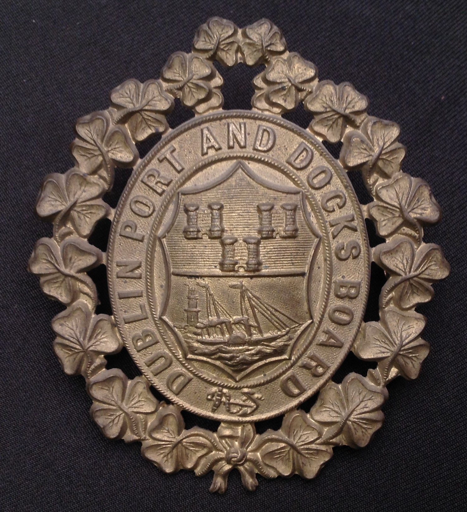 Rare Dublin Port and Docks Board Police Helmet plate. Gilt finish. Two lugs to reverse. Size approx 80mm x 72mm.
