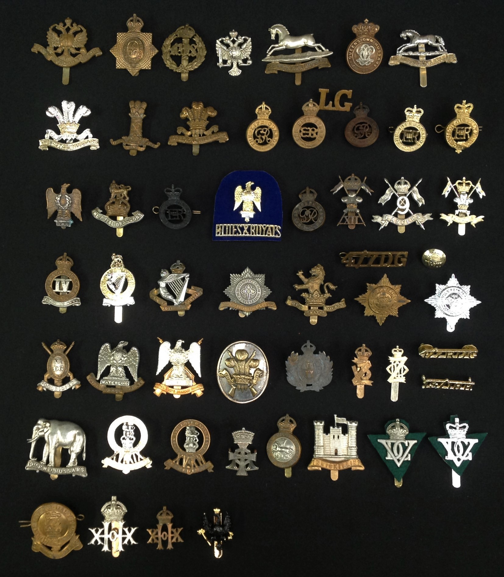 WW2 and later British Cavalry Cap Badges: Life Guards x 5: Blues & Royals: Royal Dragoons: Kings Dragoon Guards: Bays: 6th Dragoons: Royal Scots Greys: Arm badge 3rd Carabiniers: 4th Royal Irish Dragoon Guards: 7th Dragoon Guards: 4/7th Royal Dragoon Guards: 5th Dragoon Guards: 6th Inniskilling Dragoon Guards: 5th Royal Inniskilling Dragoon Guards x 2: 3rd Kings Own Hussars: 7th Queens Own Hussars: Queens Own Hussars: IV Queens Own Hussars: 8th Kings Royal Irish Hussars: Queens Royal Hussars: 9th Lancers: XII Lancers: IX-XII Lancers staybrite: 10th Royal Hussars: 11th Hussars: Royal Hussars staybrite: 13th Hussars: XVIII Royal Hussars: 13th/18th Hussars staybrite: 14th Kings Hussars: XX Hussars: 14th/20th hussars: 15th Kings Hussars: 19th PWO Hussars: Queens Alexandra's Own Hussars: 15th/19th Hussars: plus some shoulder titles.
