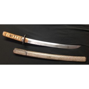 WW2 Imperial Japanese era Wakizashi Sword with single edged blade 39cm in length. No Hamon line visible. Iron Tsuba. Shagreen grip with original cloth binding with three Menuki in place. Tang is unsigned. Overall length 540mm.  Wooden Saya scabbard has some splitting to top and the Kurigata is loose.