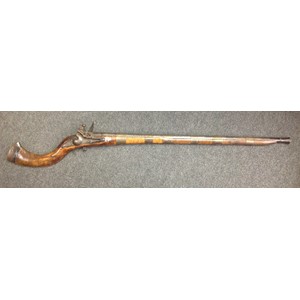 Indian Flintlock Musket with 835mm long smooth bore twisted steel barrel. Working action. Lock is East India Company marked along with 1816. Traditional Indian style stock. Broad brass barrel bands. Overall length 1170mm. Section 58, no licence required.