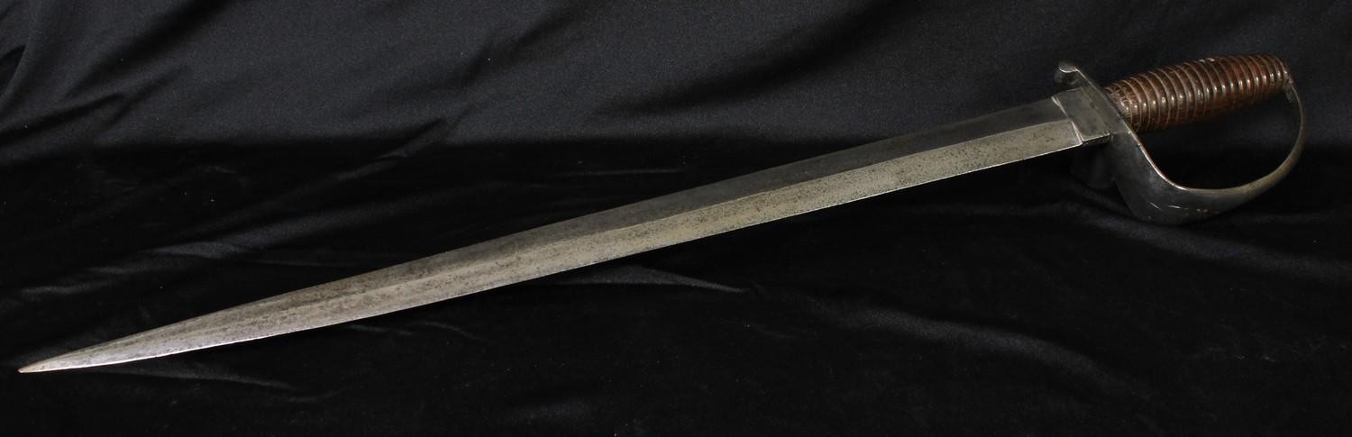 A 19th century Cutlass, 51cm pointed double-edged blade, steel stirrup hilt, ribbed hardwood grip, 62cm long overall. No makers marks. No scabbard.