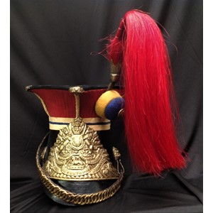 Reproduction dating from the late 20th Century of a Victorian 12th Lancers Shako Cap. Plume socket with red enlisted man's horse hair plume for the Prince of Wales's Royal Lancers. Helmet plate with Queens Crown and battle honours. Black leather backed chin chain. Lion's mask chin chain mounts. Black leather peak. Black leather sweatband. Size approx modern 57.