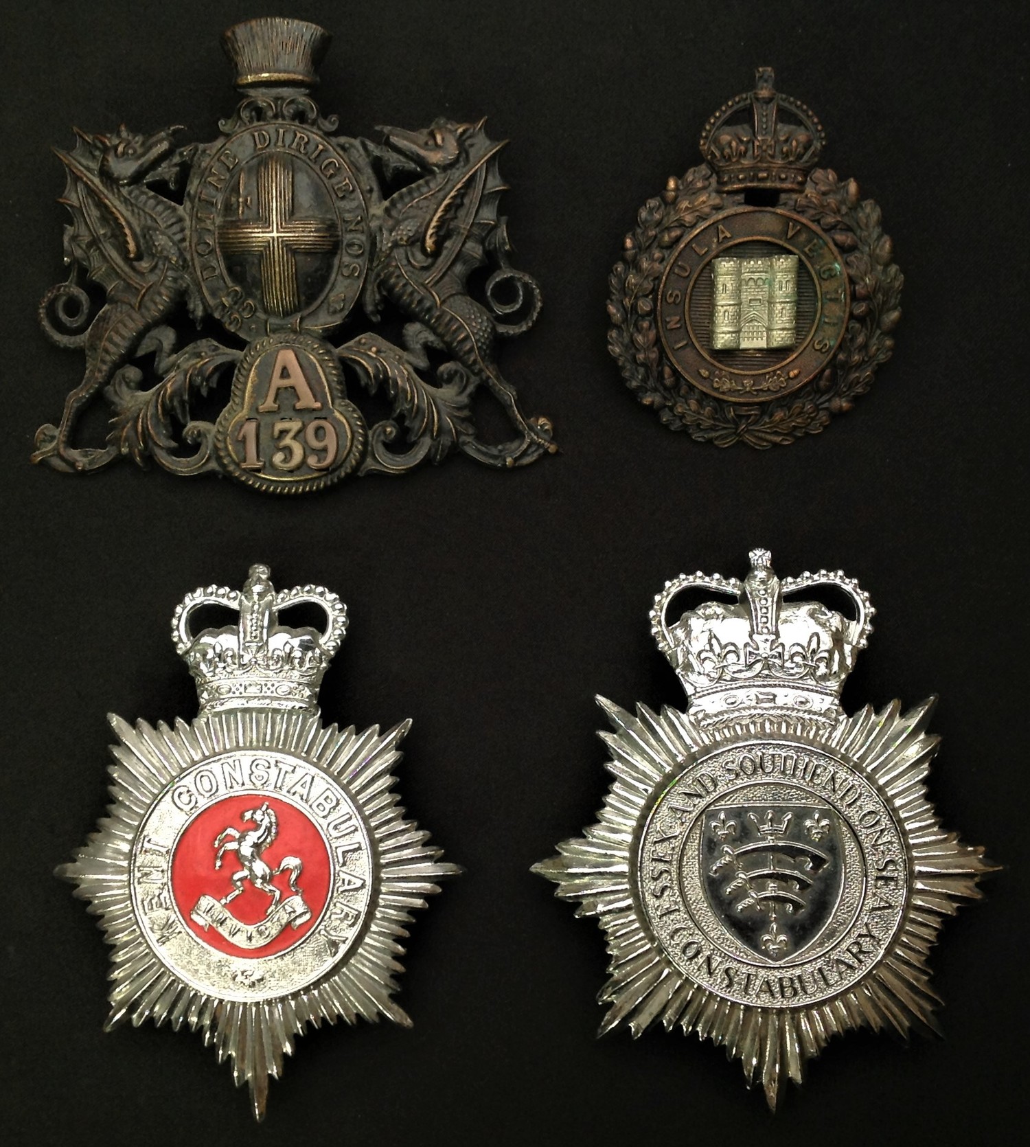 King Crown Isle of Wight Police Night Plate: City of London Police A139 Night Plate: Queens Crown Kent Constabulary enamelled Helmet Plate: Queens Crown Essex and Southend-on-Sea Constabulary Helmet Plate.  (4)