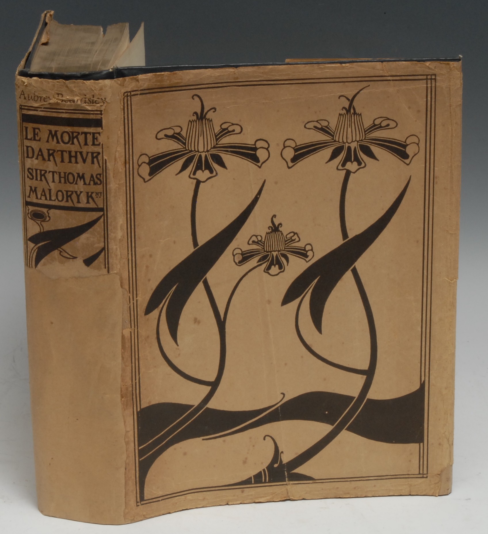 Malory (Sir Thomas) & Beardsley (Aubrey, illustrator), Le Morte d'Arthur, The Birth Life and Acts of King Arthur of His Noble Knights of the Round Table [...], one of 1,600 copies, third edition thus, London: J.M. Dent & Sons, 1927, some Gothic Black Letter printing, 21 plates, further b/w in-text illustrations, historiated initials, and decorative borders, rare in pictorial dustjacket (repaired, chipped), contemporary pictorial blue cloth gilt over bevelled boards, top-edge gilt, others untrimmed, 4to, [1]