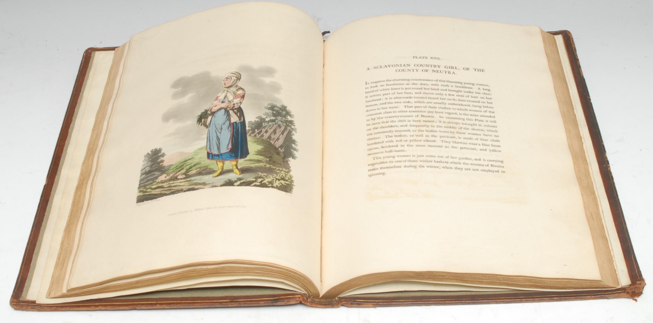 Austria-Hungary - de Moleville (M. Bertrand), Dallas (R.C., translator), & Ellis (William, illustrator), The Costume of the Hereditary States of the House of Austria, Displayed in Fifty Coloured Engravings; with Descriptions, and an Introduction, large paper copy, London: Printed for William Miller, 1804, title and descriptive text in English and French, 50 hand-coloured aquatint plates, contemporary calf binding, the relayed Neoclassical covers gilt-tooled with a singular fillet with incurved angles, flanked by broad rolled tri-partite borders of entwined laureate garlands, a paterae and dart frieze, and graduating banding,  the spine with raised bands enclosing seven-compartments, directly lettered in gilt in the second and dated in the seventh, the others enclosing meandering and scrolling foliate bosses, all-edges gilt, contemporary sage endpapers, folio (37cm x 28cm), [Abbey Travel 71; Colas 2112], [1]