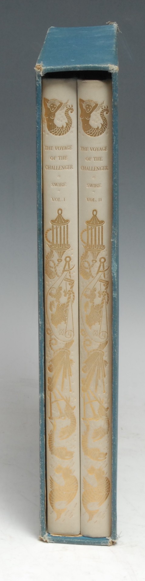Golden Cockerel Press - Travel, Swire (Navigating Sub-Lieutenant Herbert, R.N.), The Voyage of the Challenger: A Personal Narrative of the Historic Circumnavigation of the Globe in the Years 1872-1876, two-volume set, first edition, copy number 167 from a limited edition of 300, The Golden Cockerel Press: 1938, printed in Eric Gill's Perpetua type on Van Gelder paper, hand-coloured frontispieces, monochrome in-text illustrations, volume I with map endpapers (recto only), gilt pictorial vellum-coloured buckram over teal cloth, slipcase en suite, folios (32cm x 20cm), [2]