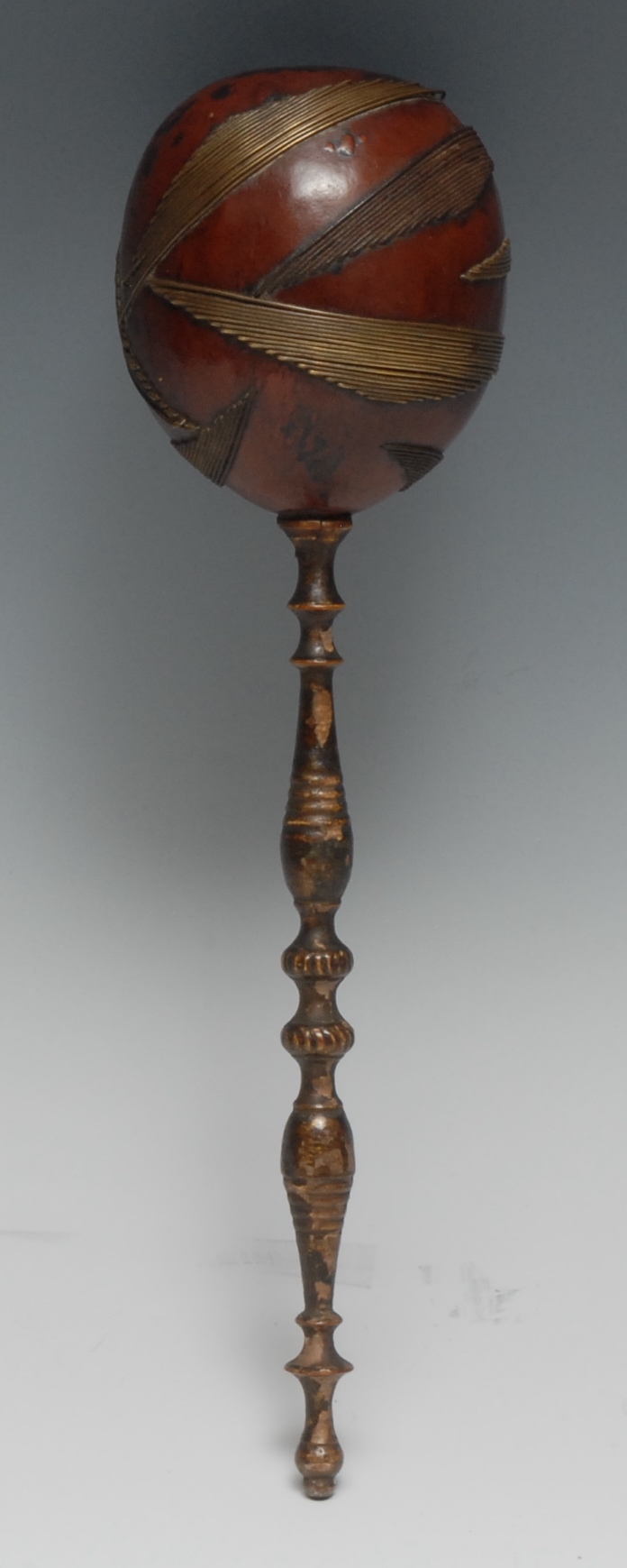 A North African shekere type instrument, applied with wire geometric motifs, 28.5cm long