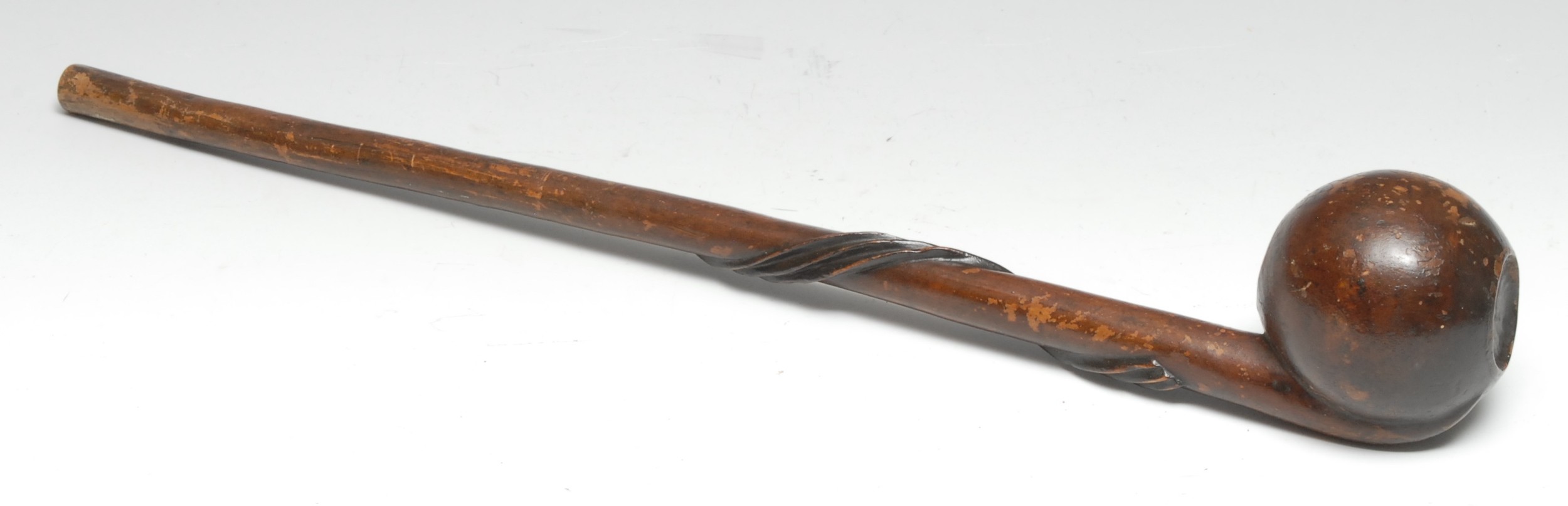Tribal Art - an African knobkerrie type club, offset bulbous head, the shaft carved in relief with a wrythen ribbon band, 57cm long, Shona/Zulu, South Africa