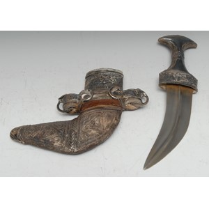 A Middle Eastern silver mounted jambiya, 17cm curved blade, horn grip, the hilt and scabbard applied with filigree and chased with scrolling foliage, 30cm long