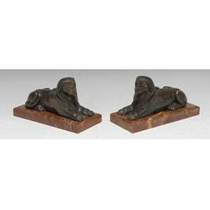 French School (19th century), a pair of Egyptian Revival bronzes,each cast as a sphinx, rectangular marble bases, 18cm wide