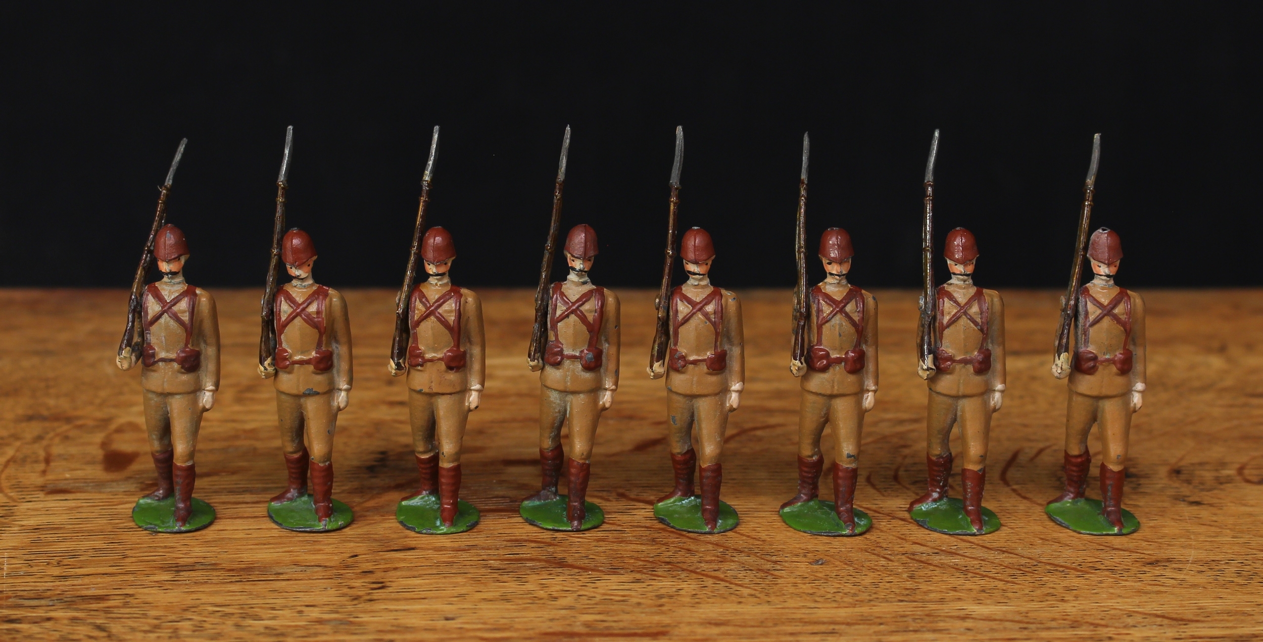 W Britain (Britains) No.110 The Devonshire Regiment, comprising eight figures, each marching at the slope with rifles, early smooth helmet versions with Slade-Wallace equipment, unmarked oval bases, unboxed (8)