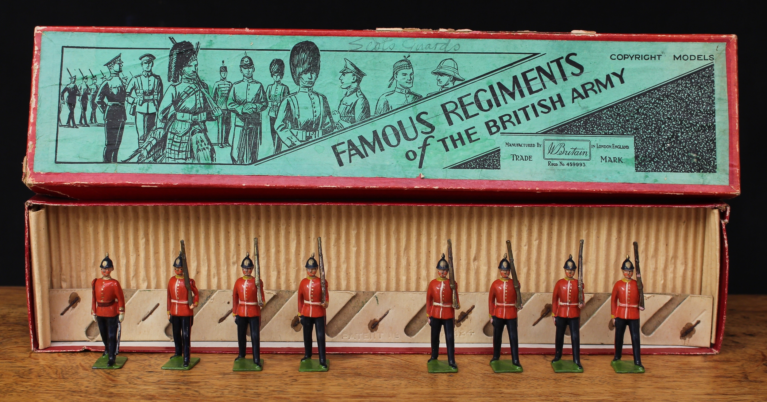 W Britain (Britains) Famous Regiments of the British Army No.1586 The Northamptonshire Regiment, comprising marching empty handed officer and seven figures, each marching at the slope, boxed with original inner corrugated packaging piece and inner cardboard display stand - green label to box lid