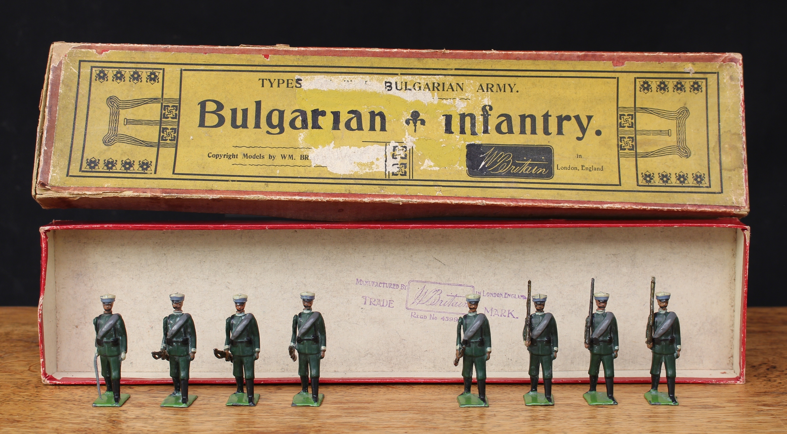 W Britain (Britains) Types of the Bulgarian Army No.172 Bulgarian Infantry, comprising officer with drawn sword and seven figures, some marching at the slope and trail arms, each with 'Depose 1904' to underside of base, boxed - yellow label to box lid