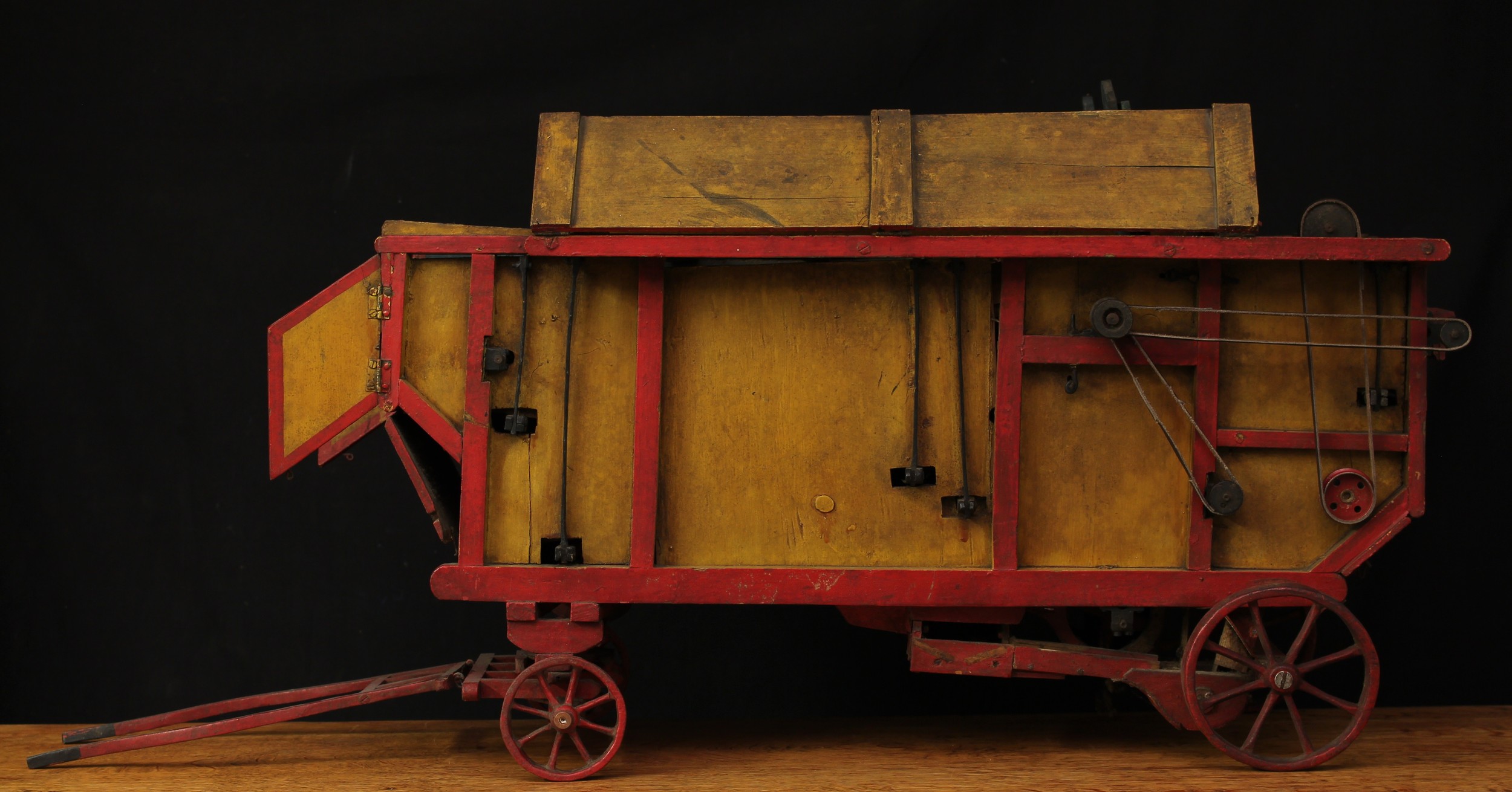 Farming and Agricultural Interest - a scratch built scale model of a threshing machine, painted wooden construction, 90cm long, probably an exhibition model for being shown at agricultural and live steam fairs