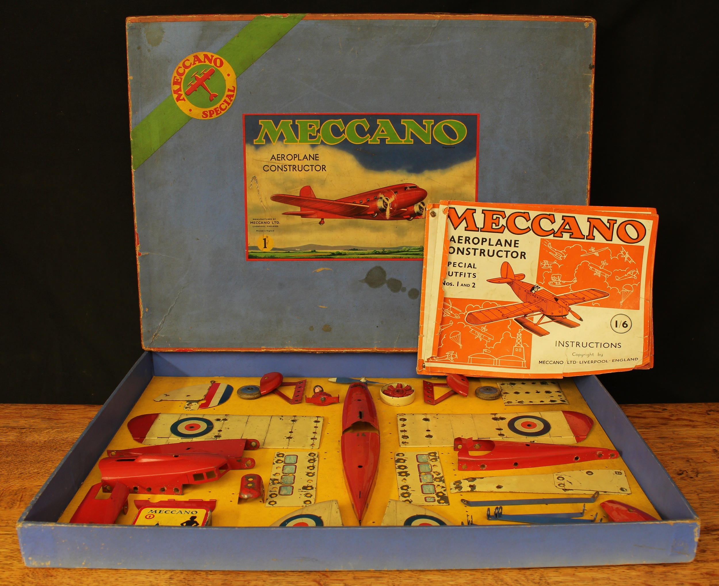 A 1930's Meccano No.1 Special aeoplane constructor outfit, comprising various red, blue and cream outfit parts, unstrung from inner cardboard display piece, boxed with instructions for special outfits No.1 and 2