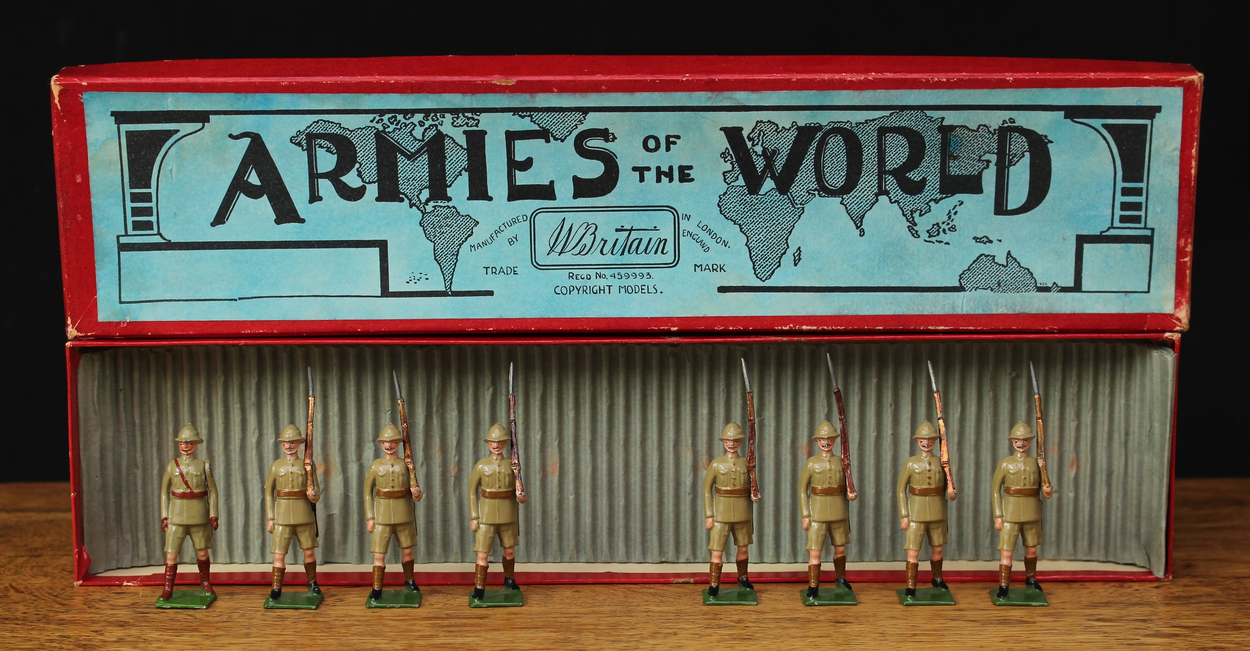 W Britain (Britains) Armies of the World "Cunningham" series, No.1294 British Infantry (tropical dress), comprising marching empty handed officer and seven figures, each marching at the slope, boxed with original inner corrugated packaging piece - blue label to box lid