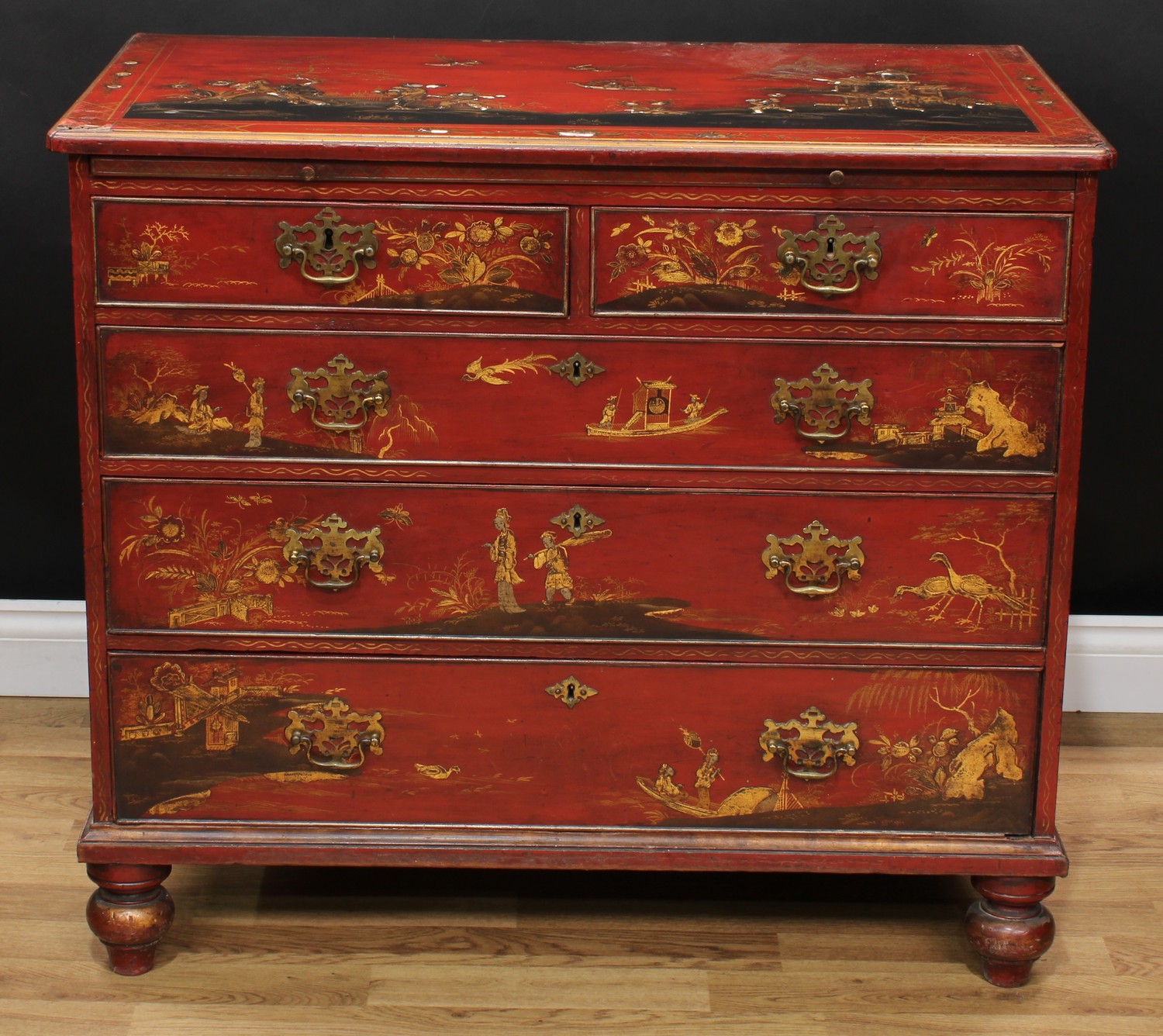 A 19th century Japanned chest, slightly oversailing rectangular top with moulded edge above two short and three long graduated cockbeaded drawers, swan neck handles, pierced bat wing escutcheons, decorated throughout in the Chinoserie taste with figures, ornithological subjects and pagodas, skirted base, turned feet, 84.5cm high, 96.5cm wide, 55.5cm deep