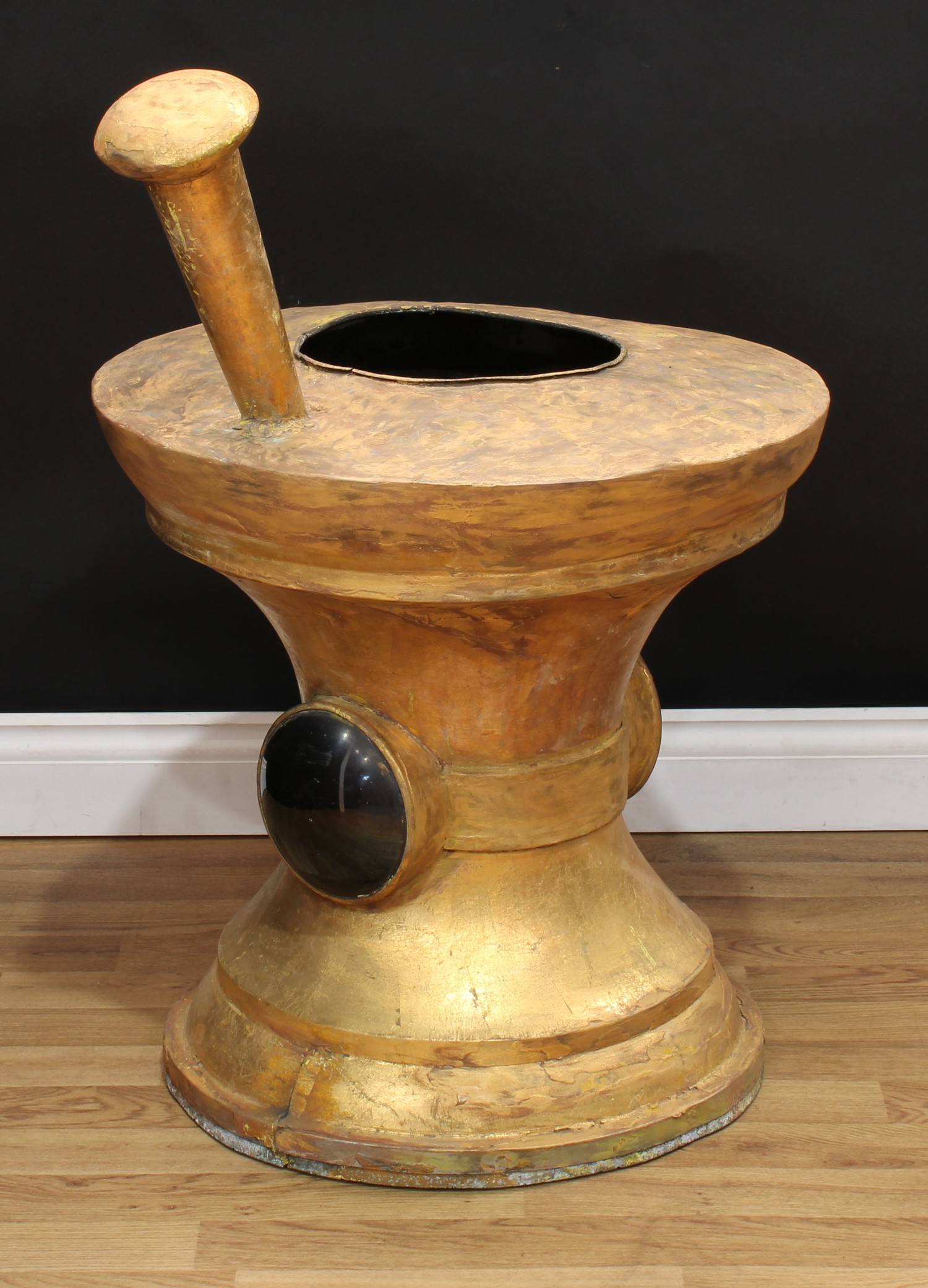 A large 19th century copper chemist's advertising apothecary shop sign, as an oversize pharmaceutical pestle and mortar, the side set with lenses to hold a lamp, gilt finish, 89cm high