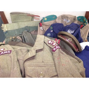 Post War British RAMC Officers uniform grouping to 453847 Captain J.A.K Wightman. This large and extensive collection of items to this officer is contained within a leather suitcase and comprises of: two 1949 pattern Battledress Blouses with RAMC insignia: Officers Service Dress cap with badge by Bates of London:  two pairs of 1949 pattern BD trousers: two Airtex Jungle Green shirts, one with full insignia: Jungle green shorts x 2: white dinner jacket: blue sports shorts x 2: CC41 marked blue swimming trunks: CC41 marked blue jumper: 1937 pattern web belt: 1944 pattern web belt: pair 1937 pattern gaiters: Officers tie: spare shirt collar: CC41 marked Blue Boy Scouts shirt with Notts insignia: khaki Boy Scout shirt with full Notts insignia: hose top socks in khaki and red: school scarf. Suitcase has pre 1948 LMS Railway luggage labels affixed.