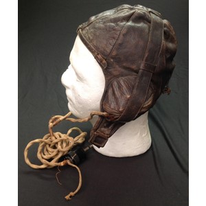 WW2 RAAF Australian Pattern Leather Flying Helmet. Similar to the RAF B type. Makers label "Lasicas, Australia". Chin strap has been cut off. Complete with headsets and wiring loom with jack plug.