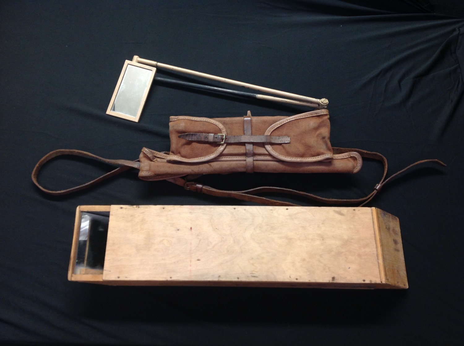 WW1 British Officers Private Purchase Trench Periscope Mirror. Contained within a canvas and leather trimmed pouch complete with spare mirror. No makers markings or date. Size extended approx 75cm. Along with a home made wooden box periscope . (2)