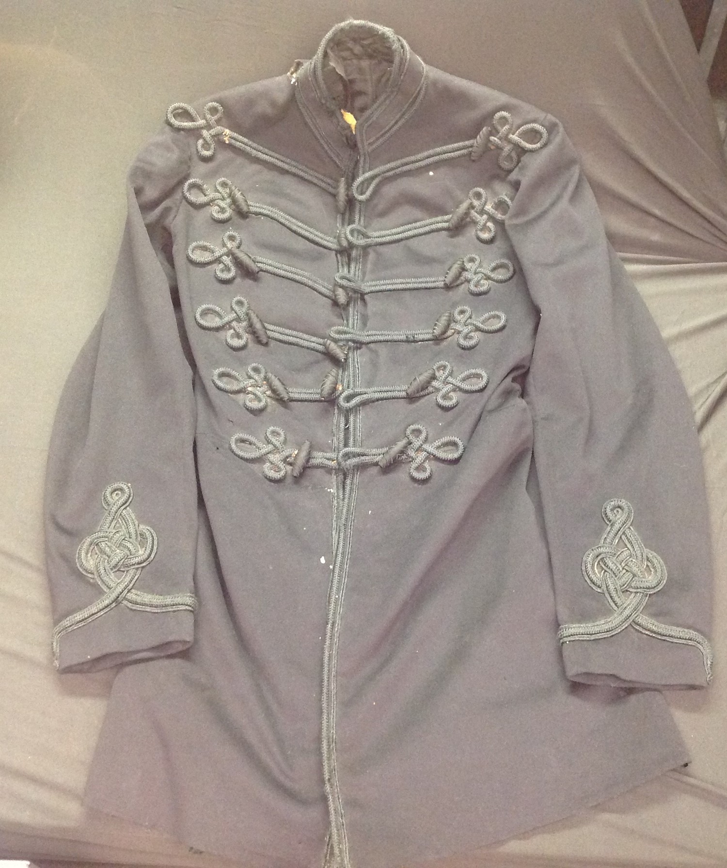 Victorian Army Officers Frock Coat. No makers label. Collar and lining require repair. Hook and eye fastenings. Lower toggle is missing.