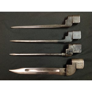 WW2 British No 4 MkI Cruciform Bayonet, rare early production model by the Singer Sewing Machine Company. Correctly marked GR Crown, No 4 MKI SM, opposite side numbered 577, along with SM41 to release catch. Blade length 190mm, overall length 250mm. No scabbard. Plus two No 4 MKII Bayonets, both without scabbards and a No9 Mk1 bayonet without scabbard. (4)