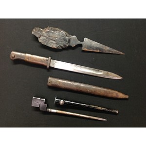 WW1 Imperial German Mauser G98 S1884/98 bayonet with single edged fullered 250mm long blade maker marked "Erfurt" plus "W15" to spine of blade. Guard is unit marked "15. U. 2. 12 ". Wooden grip with flash guard. Working release catch. Overall length 385mm. Complete with unit marked scabbard, 15. U. 89. Plus a large trench art shrapnel letter opener with 145mm spear point blade, overall length 320mm. Along with a WW2 British No4 Spike bayonet and scabbard. (3)