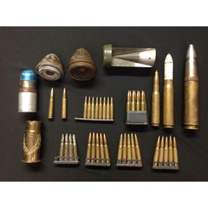 A collection of mixed assorted INERT FFE rounds, shell fuzes, etc. To include tail fin from a WW2 German incendiary bomb, US M1 Garand clip with various dated .30-06 rounds, two British fuses inc No80 V, clip of .233 rounds, clips of British .303 rounds, WW1 trench art German shell case, post war .50 cal round, post war 30mm Cannon round, post war 20mm cannon round, 40 x 46 Rifle Grenade, etc.