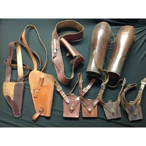 WW2 British / US / German leatherwork collection to comprise of: two leather shoulder holsters, both unmarked: four Sam Brown leather Sword frogs: various leather straps and cross straps: pair of high leg leather gaiters: Cross strap with pouch and Whistle: US holster adapter dated 1946: single German Luftwaffe issue brown leather K98 ammo pouch a/f. (Q)