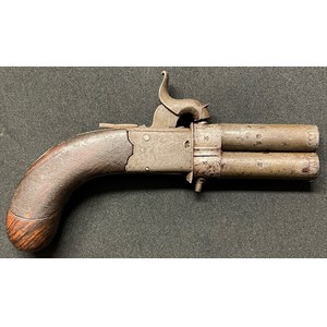 A small revolving double barrel Percussion cap pistol. Barrel length 67mm. Heavily rifled bore approx 8mm. British proof marks. Overall length 170mm. Folding trigger. Silver escutcheon plate which is plain. Action a/f. Section 58, no licence required.