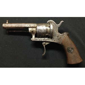 Belgian made Pinfire Revolver with 73mm long octagonal barrel. Bore approx 7mm. Cylinder marked "The Guardian American Model 1878" along with Leige proof marks. Single action. Chequered wooden grips. Frame, folding trigger and cylinder numbered 58. Working clearing rod. Overall length 175mm. Section 58, no licence required.