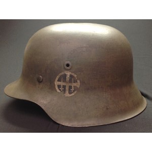 WW2 Third Reich M42 Stahlhelm Steel Helmet. Has been reused as a film prop or for re-enactment. Non original paintwork for the Norwegian Nasjonal Samling. Liner replaced with a 1939 dated size 7 British liner. Helmet shell has lot number 3792.