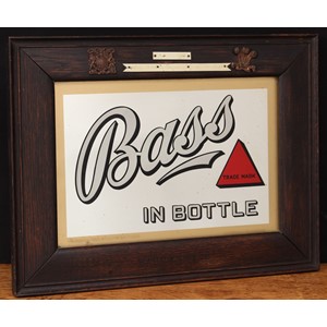 Advertising, Breweriana - an early 20th century Bass rectangular advertising point of sale pub/brewery mirror, "Bass IN BOTTLE", in black and white lettering with trademark red triangle logo, gilt border, framed, the lower edge border stamped 'BASS & CO LTD', the lower right corner of the glass etched with the makers mark for O.C. HAWKES BIRMINGHAM, 34cm x 44cm (measurements including frame)
