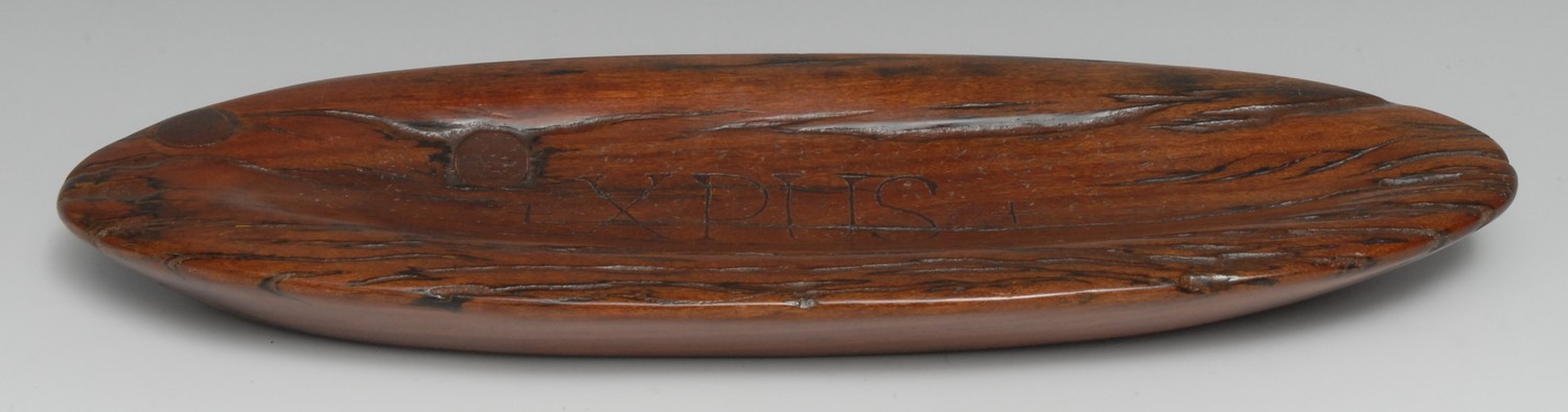 Witchcraft and The Occult - an apocryphal salvaged timber bowl or stoup, incise carved XPUS, the base with feint ink inscription St Mary's Ch [Church] 1356, 35cm wide