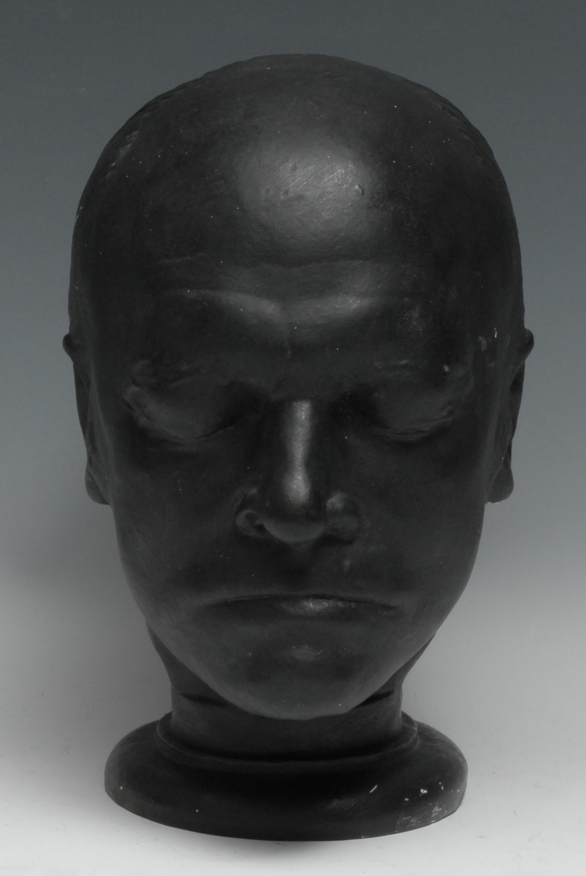 William Blake - After James De Ville (1777-1846), a black-painted plaster phrenology head, William Blake (1757-1827), inscribed to verso: 'A66 /PUBd AUG 1 1823 J. DEVILLE, 67 Strand London', the parietal with traces of bronzing, circular plinth base, 29cm high  James Deville (1777-1846) was a sculptor and phrenologist employed as an assistant to Joseph Nollekens. Phrenology was popular in the early 19th century following the publications of both Lavater and Spurzheim, and Blake himself was an advocate of this new 'science', in which the shape and contours of the skull are examined to indicate mental capacity and character. Fifty-six years old at the time the mould was taken in 1823, Blake was considered a perfect representation of "imaginative faculty". Very few original copies of Deville's Blake life mask exist, with examples in the National Portrait Gallery, London and the Fitzwilliam Museum, Cambridge.