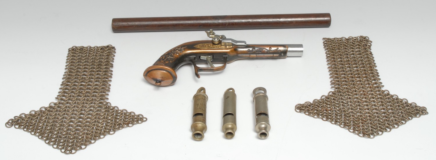 A pair of chainmail epaulets, 20cm long; a police whistle, The Metropolitan Patent, Isle of Man Constabulary, by J Hudson & Co, 131 Barr Street, Birmingham, 8.5cm long; others; a novelty cigarette lighter, as a flintlock pistol; a George III cylindrical ruler (7)