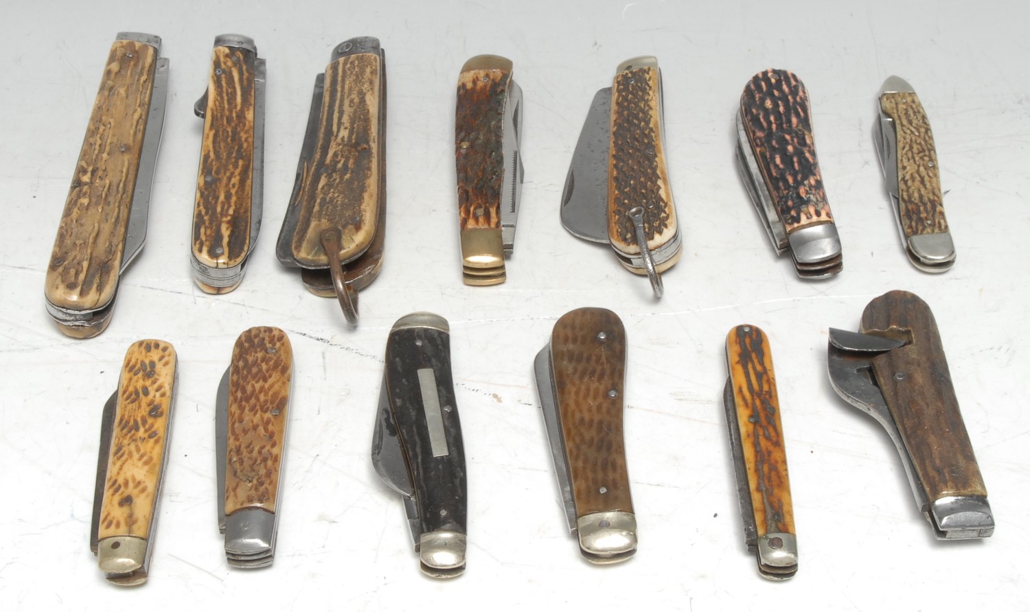 Machirology - a 19th century pocket clasp knife, Taylors Eye Witness, 10cm blade, smaller secondary blade, two-piece stag antler grip12cm long (folded); others, similar, various forms, dates and makers, George Wostenholm; Needham, Sheffield; Unity; etc (12)