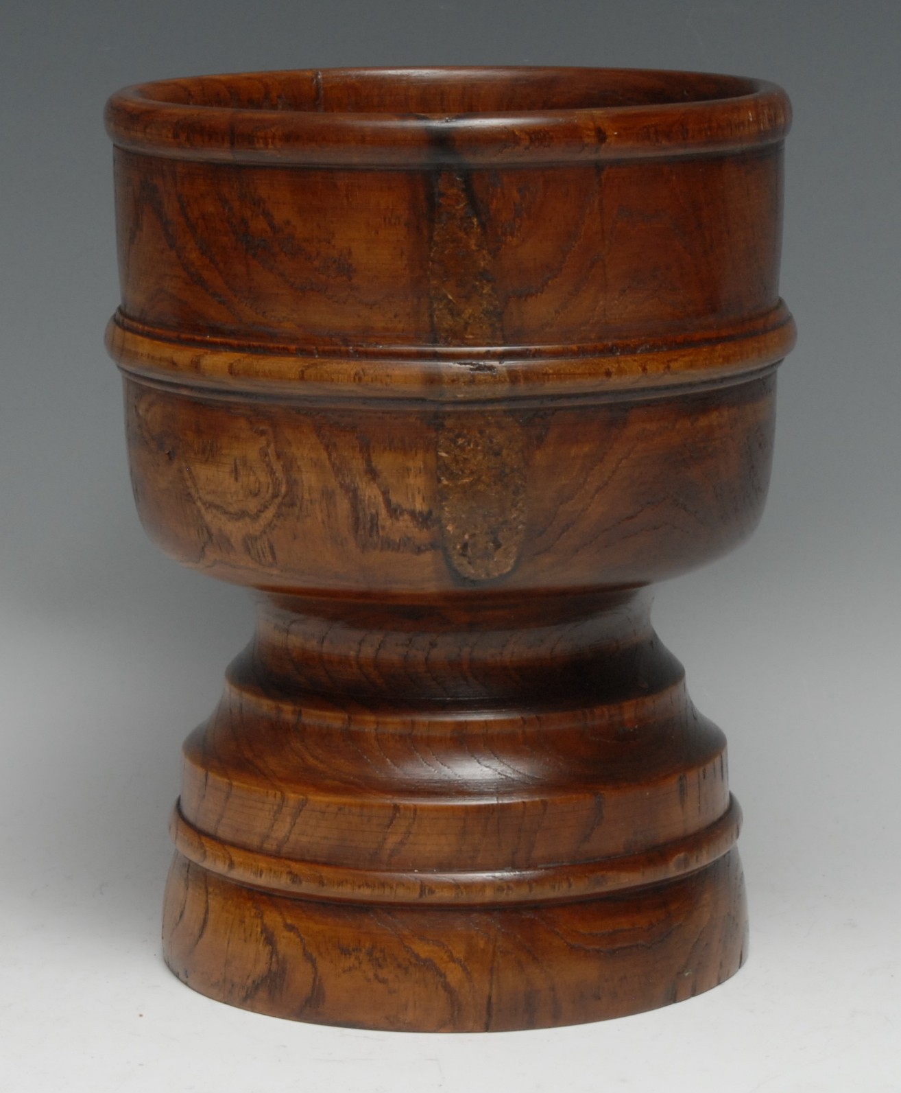Treen - an elm standing cup, turned in the manner of a wassail bowl, 20.5cm high