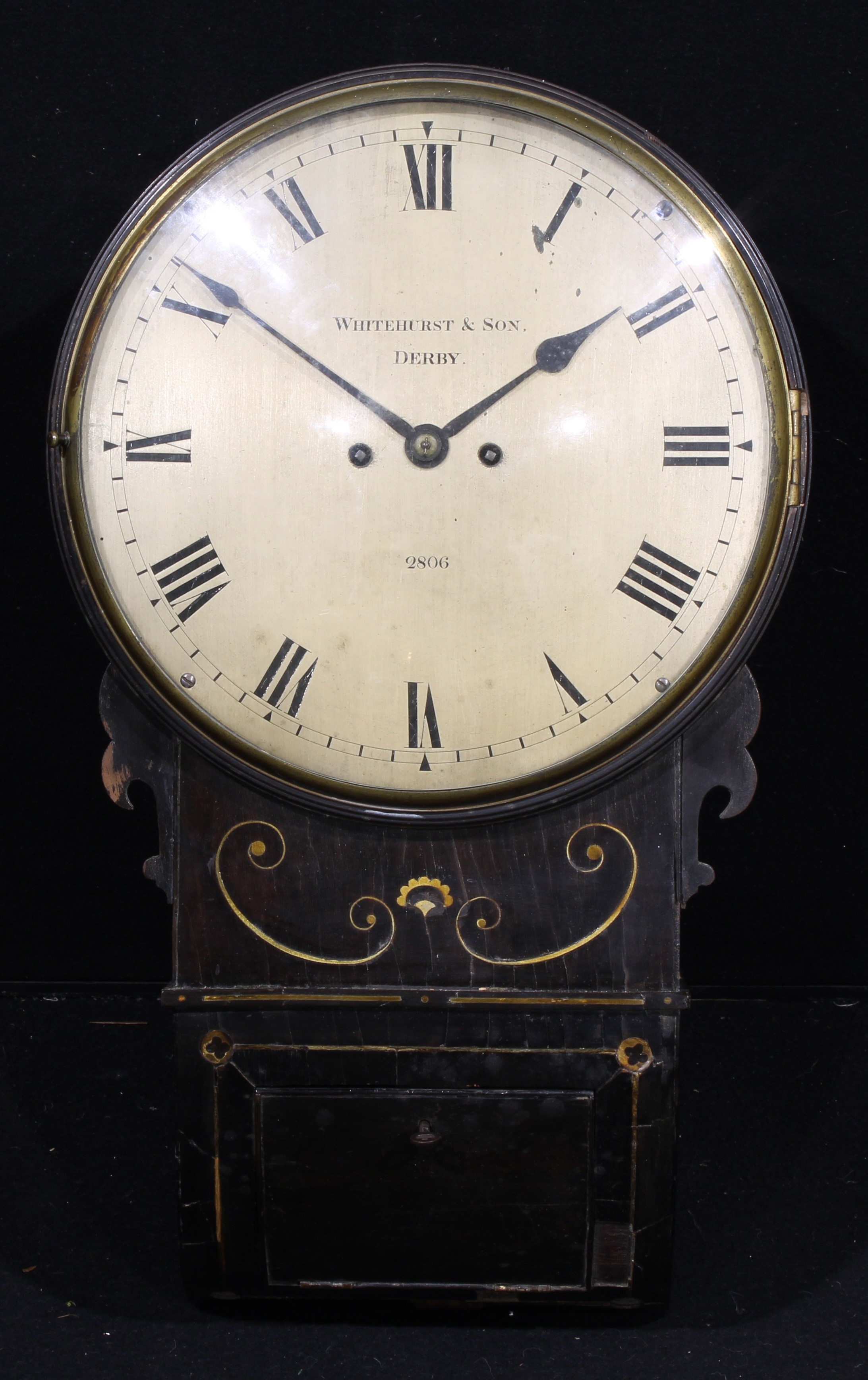 An early 19th century ebonised wall clock, 30.5cm dial inscribed WHITEHURST & SON, DERBY, 2806, Roman numerals, twin winding holes, twin fusee movement striking on a bell, 58cm high  The number 2806 indicates the clock was made by John Whitehurst II (1766-1834) in 1820.