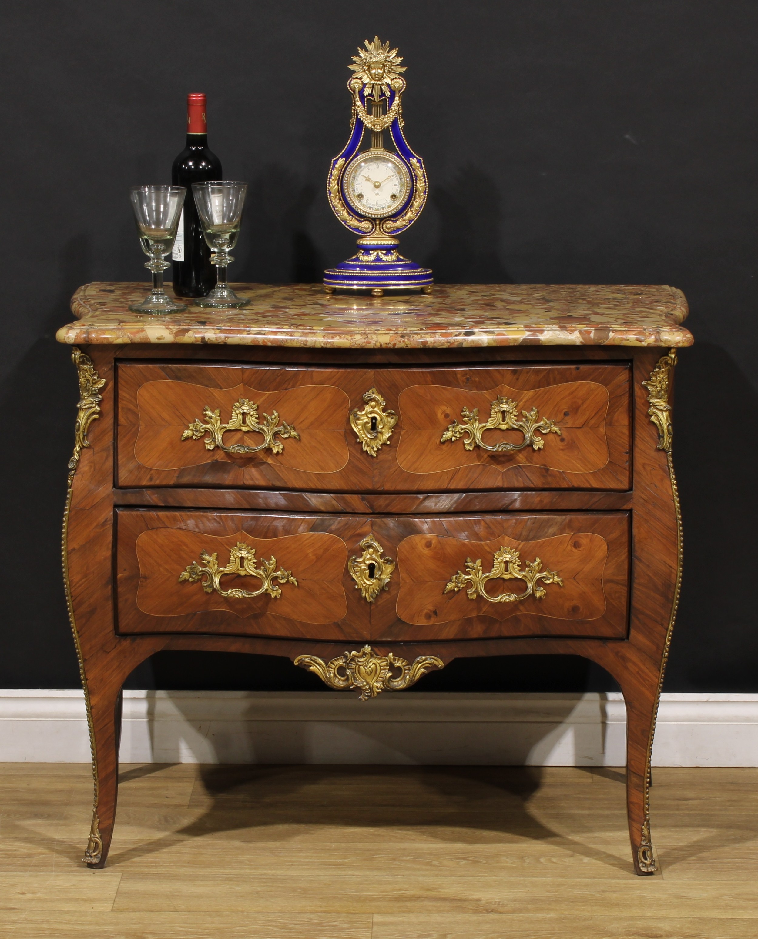 A 19th century French Louis XV Revival gilt metal mounted kingwood serpentine commode, marble top above two long drawers, 80cm high, 94cm wide, 53.5cm deep, c.1870