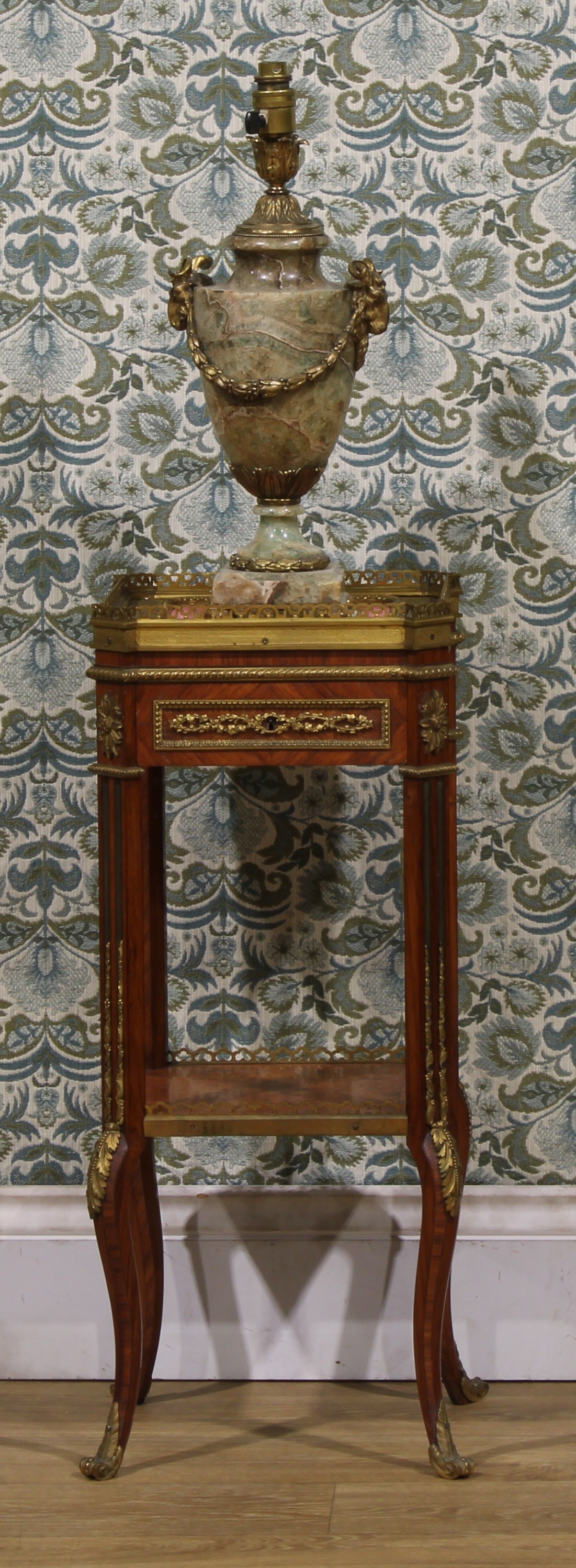 A 19th century Louis XVI Revival gilt metal and porcelain mounted kingwood and burr walnut kettle or urn stand, the top with pierced gallery and set with a panel painted in the manner of Sèvres with an ornithological study within a Rose Pompadour border, drawer to frieze, fluted angles, cabriole legs, 72.5cm high, 29.5cm square, c.1870