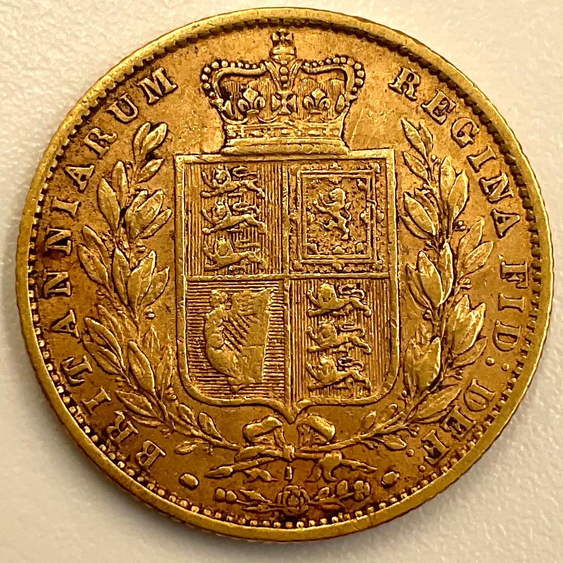 A Victorian young head gold shield-back sovereign, 1871