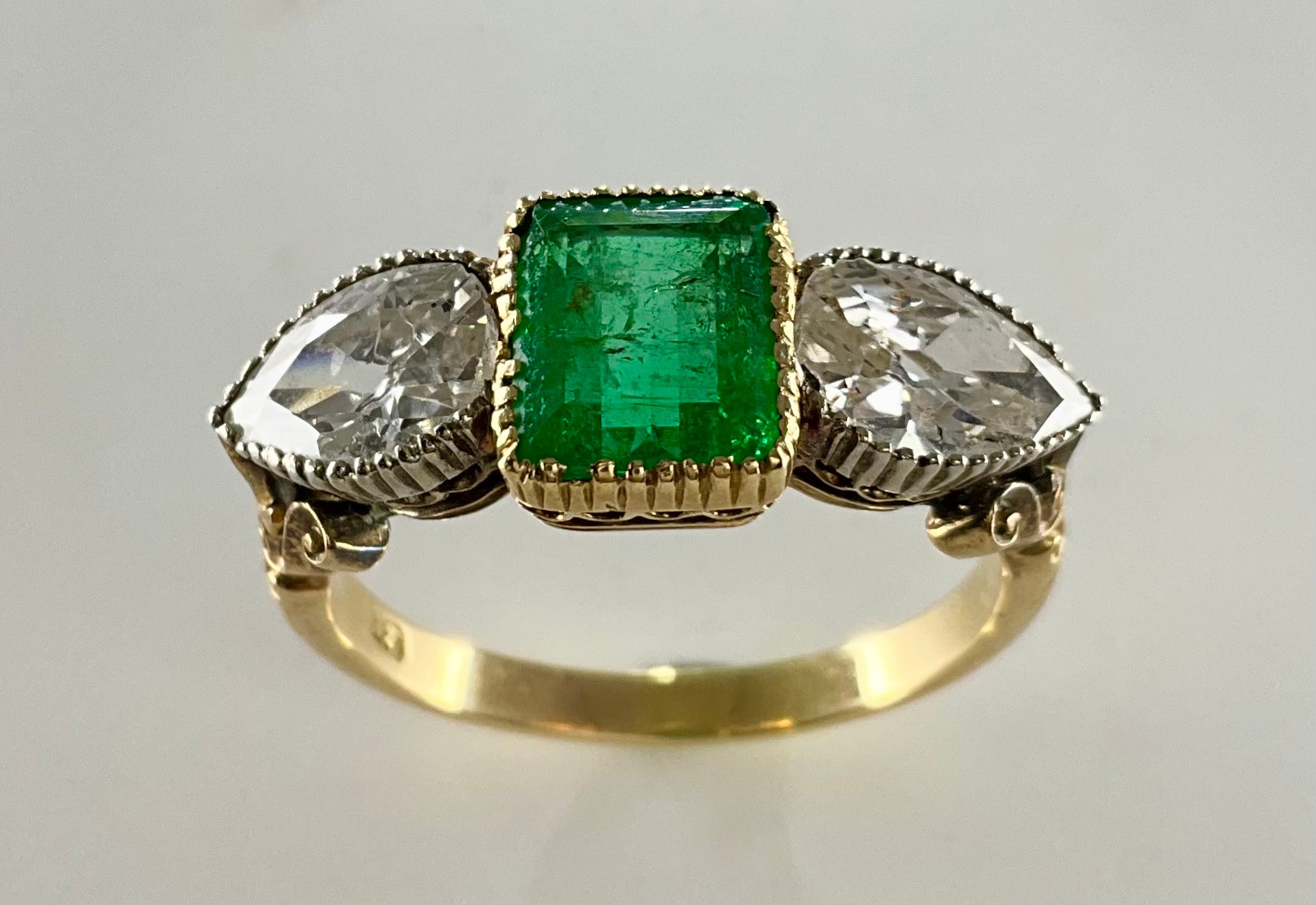 An Antique 18ct gold emerald and diamond dress ring