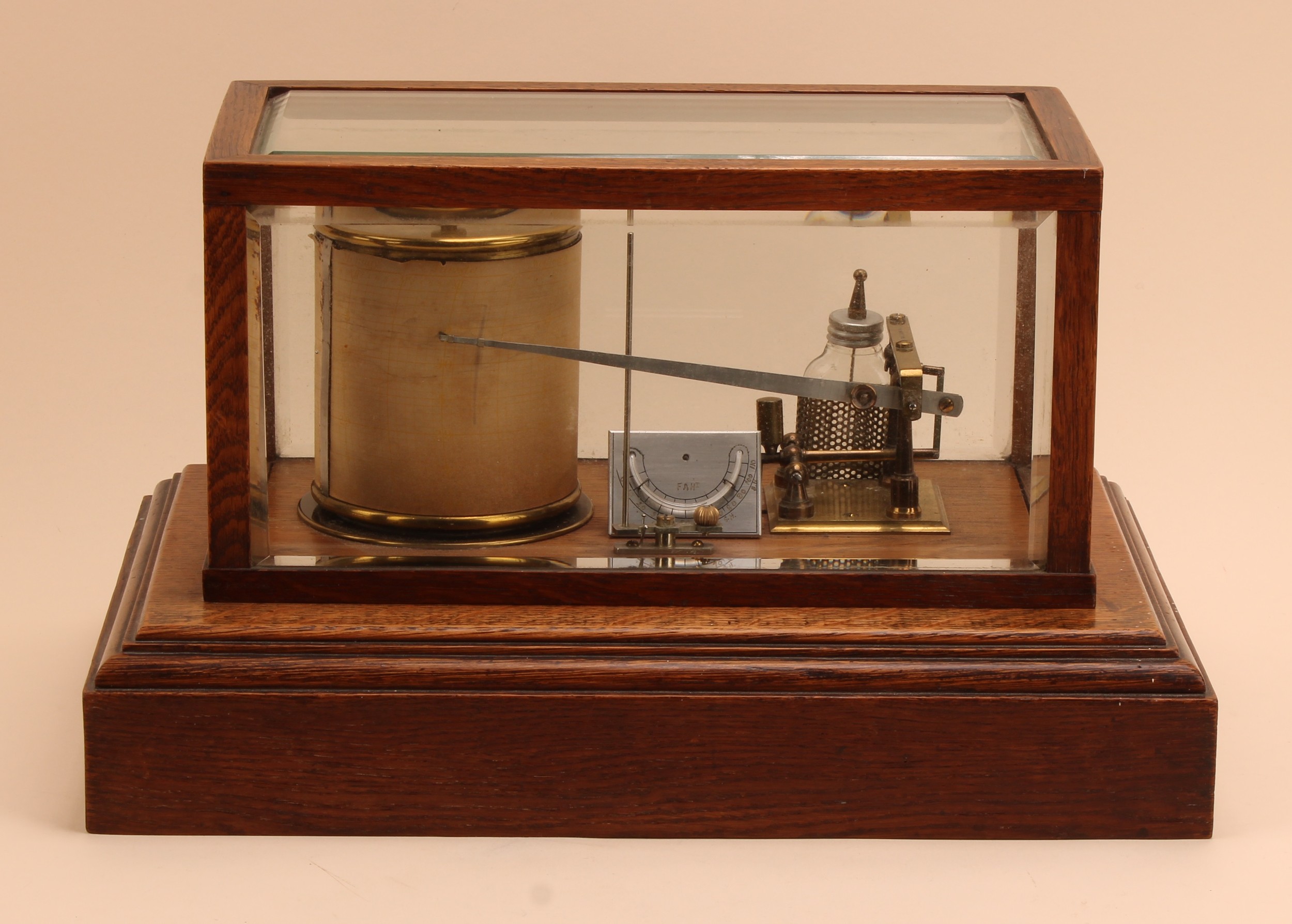 A late Victorian/Edwardian oak barograph, marked Pat. No. 22556, bevelled glazed case, plinth base, 38.5cm wide, c.1900