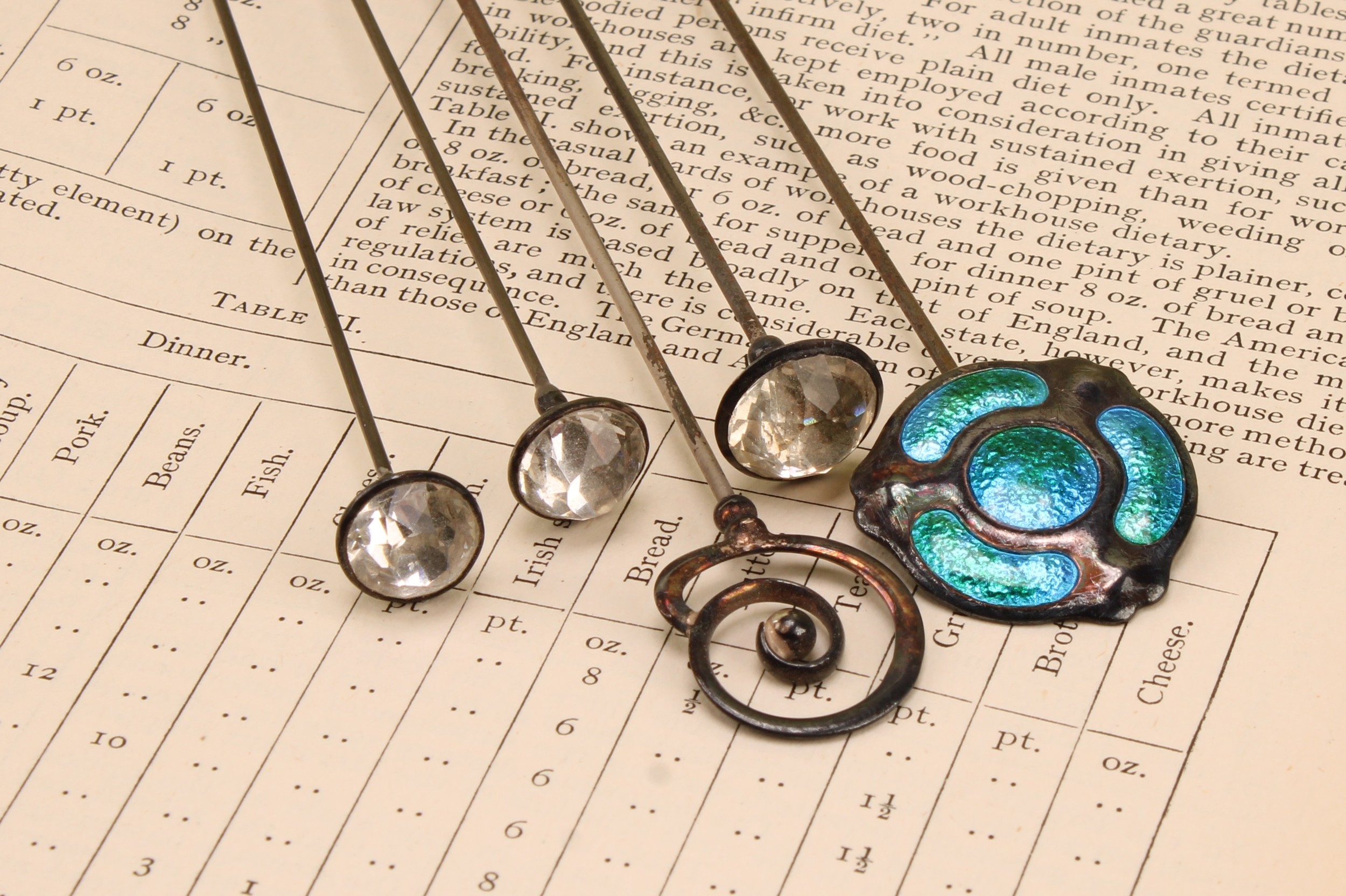 Charles Horner - an Art Nouveau silver and enamel triform swivel top hat pin, 27cm long, Chester 1909; other Charles Horner silver topped hat pins (5)